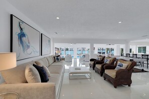 Relax in this stylish living area with a comfortable sofa, coffee table, and armchairs.