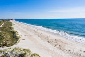 Enjoy a serene beach experience with access to the ocean and a wide stretch of sand.