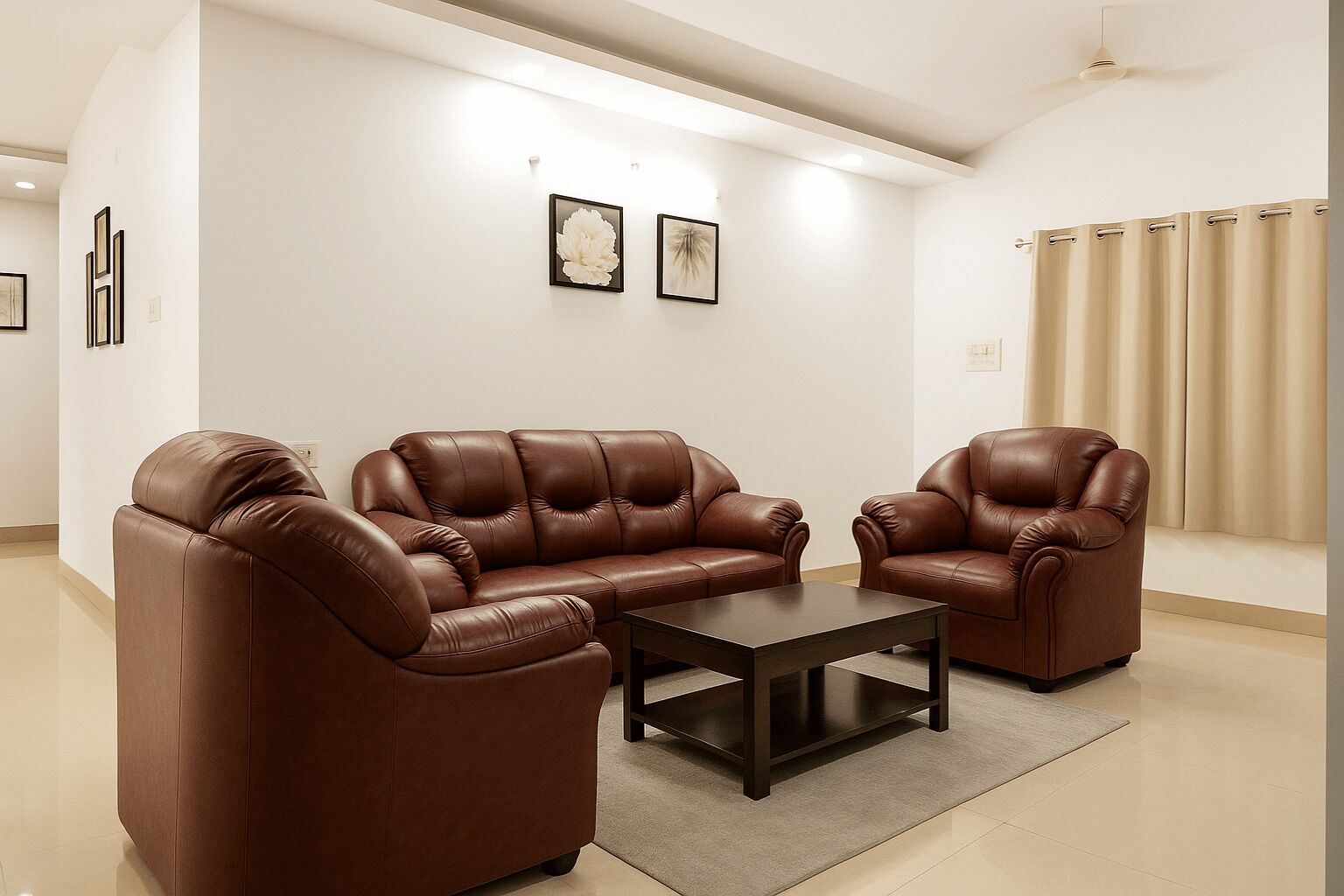A modern living room with a brown leather sofa set, a matching armchair, and a coffee table.