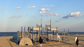 On the beach, sun-loungers