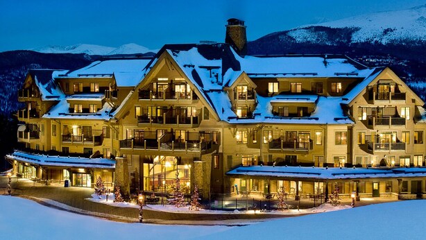 A large, multi-story lodge with a symmetrical facade, multiple balconies, and a snow-covered roof. - Ski-in/Out 10 Yards to  Lift Arcade Bowling Pool/Hot Tub Pool Table   (Breckenridge)