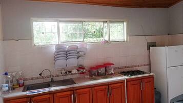 Fridge, stovetop, cookware/dishes/utensils, dining tables