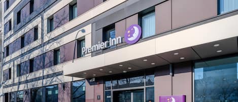 A Premier Inn hotel with a modern facade, large windows, and a prominent signage.