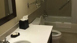 A bathroom with a sink, toilet, and shower. - Amazing 3 bedroom condo (Philipsburg)