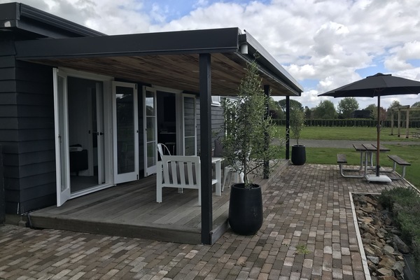 Deck area with open living from Kitchen area and lounge space