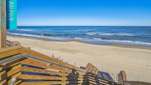 A wooden boardwalk leading to a beach with a clear blue sky. - 220ft from beach access! Private pool, hot tub. Summer deals! (Corolla)