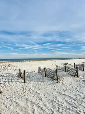 A sandy beach with wooden fences and a clear sky. - Renovated retreat w/ private beach access, short drive to Historic District (St. Augustine)