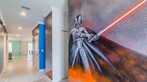 A hallway with a mural of Darth Vader holding a lightsaber. -  6 Br/5 Ba Pool/Game /Themed Handpainting Villa (Kissimmee)