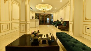 A luxurious lobby with a grand chandelier, plush seating, and a reception desk. - Kingdom Hotel Hanoi (Hanoi)