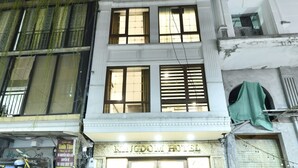 A hotel with a sign reading "KINGDOM HOTEL" and a visible entrance. - Kingdom Hotel Hanoi (Hanoi)