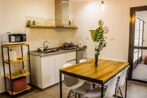 Fridge, microwave, electric kettle, cookware/dishes/utensils