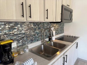 Microwave, stovetop, coffee/tea maker, toaster