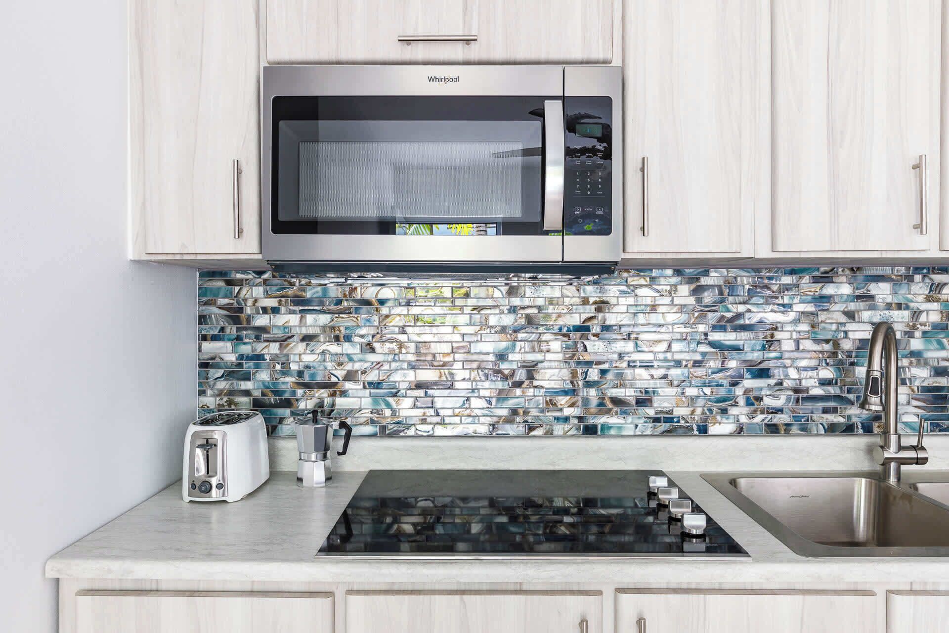 Fridge, microwave, stovetop, coffee/tea maker