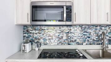 Fridge, microwave, stovetop, coffee/tea maker
