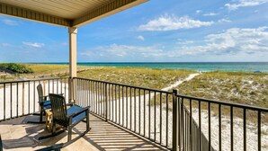 A covered outdoor area with a view of the beach and ocean. - Luxurious Beachfront End Unit Townhome |Unobstructed Gulf Views |Step onto Sugar White Sands |Garage (Navarre Beach)