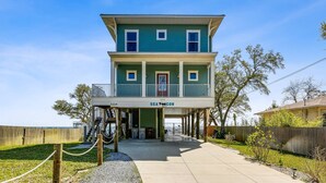 A two-story house with a balcony, labeled "SEA DOGS" and "5129" on the front.