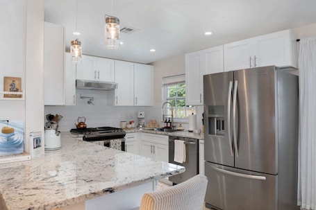 Fridge, microwave, oven, stovetop. Thai · Cozy Ginger Home with Pool · 12 minutes to Beach · Pet-Friendly