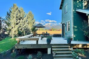 Relax on the deck surrounded by lush gardens and take in the breathtaking mountain views.