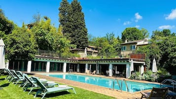 Indoor pool, seasonal outdoor pool, pool umbrellas, sun loungers