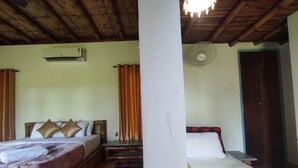 A room with two beds, a wooden ceiling, an air conditioning unit, and a fan. - Homocation Sikhiri Cottages (Barnagar)