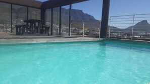 Outdoor pool - SECURE , SELF CATERING, SPACIOUS 1 BD  UNIT.   SLEEPS 4 comfy. MT & SEA VIEWS (Cape Town)