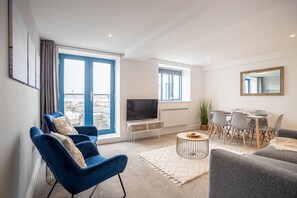 Deluxe Apartment, 2 Bedrooms, Harbour View | Living area | 42-inch flat-screen TV with cable channels, TV