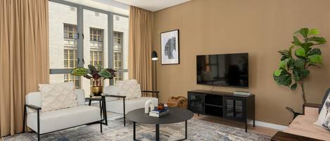 Leilighet – exclusive | Oppholdsområde | En 40-tommers Flatskjerm-TV med kabel-kanaler samt TV og Netflix