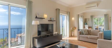 52-inch flat-screen TV with cable channels, TV