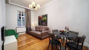 Two Bedroom Apartment ( 1121 | Living area | 20-inch LCD TV with satellite channels