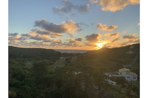 A landscape with a house and a road. - Amazing 4 BR Villa with fantastic views- 3 min from the beach! (Cap Estate)