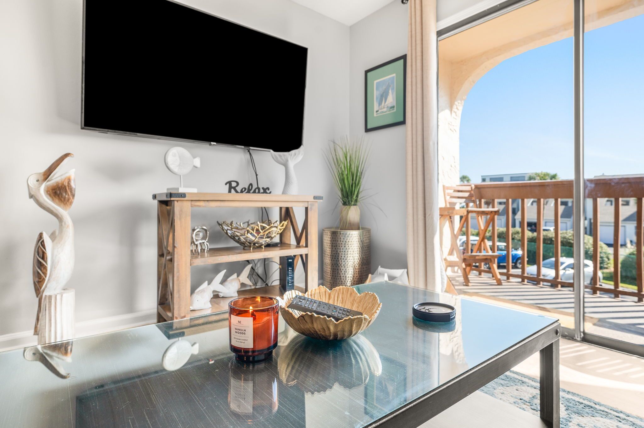 Entertainment center with a flat-screen TV and decorative shelving.