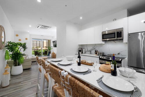 Steps from Palm Beach • Rooftop Pool • Spacious, Modern & Fully Equipped