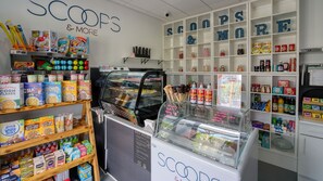 A store with shelves stocked with cereals, snacks, and ice cream cones. - Stewarts Resort Lodge 29 - a lodge that sleeps 6 guests in 2 bedrooms (St Andrews)