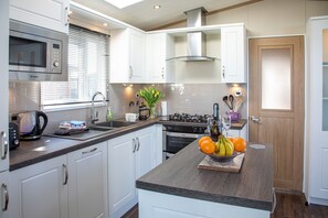 Fridge, microwave, oven, cookware/dishes/utensils - Stewarts Resort Lodge 30  -  a lodge that sleeps 4 guests  in 2 bedrooms (St Andrews)