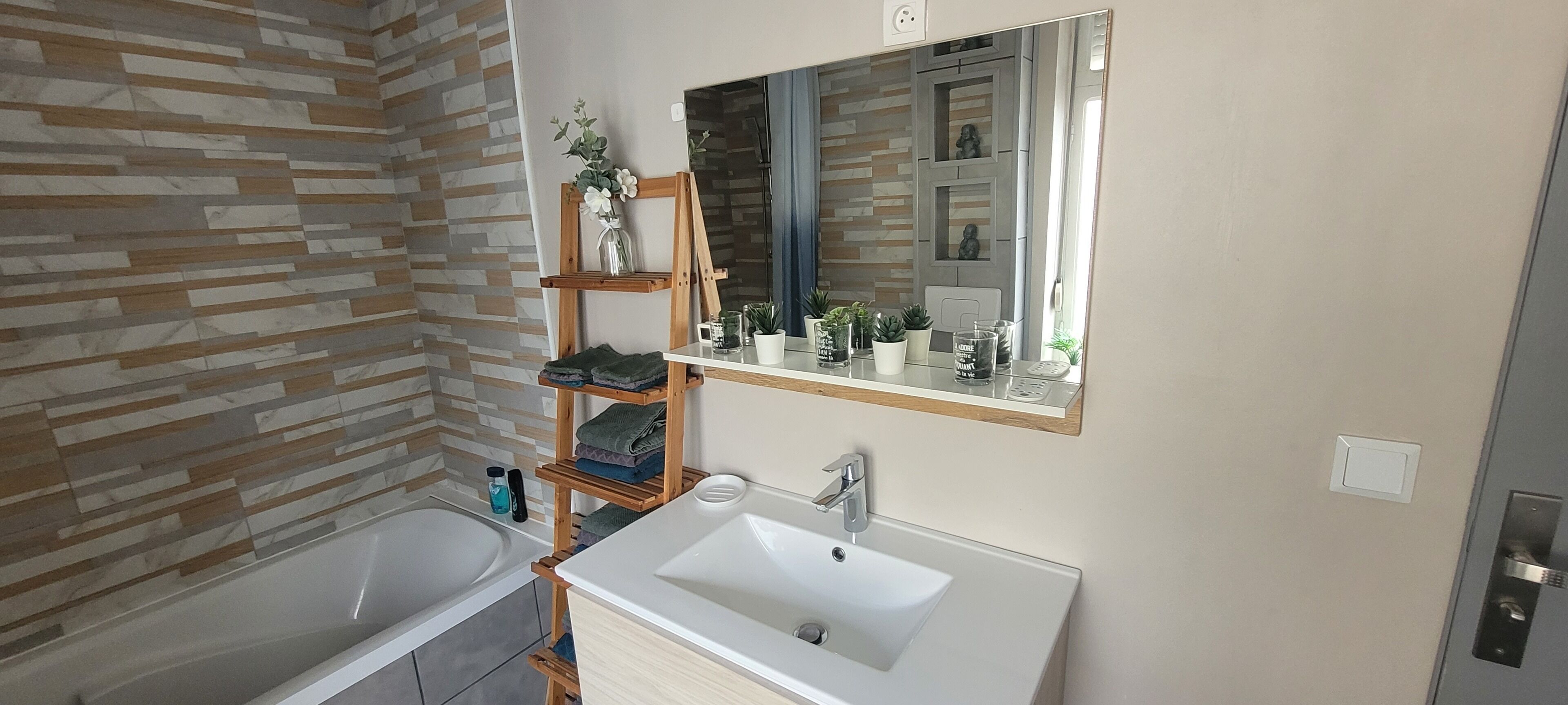 Bathtub, hair dryer, towels, soap