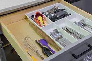 Kitchen essentials are neatly organized in this well-maintained space.