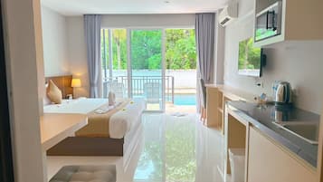 Deluxe Double Room, Pool Access | Individually furnished, desk, laptop workspace, free WiFi