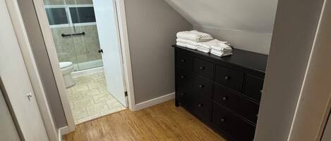 Shower, hair dryer, towels, soap