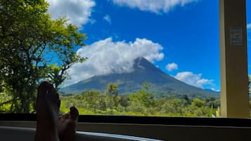 Volcano View Suite | Bathroom | Bathtub, hair dryer, towels