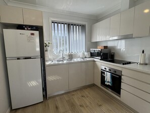 Fridge, microwave, stovetop, coffee/tea maker