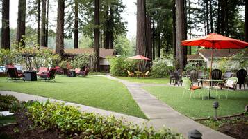 A well-maintained outdoor patio with seating arrangements and a pathway.