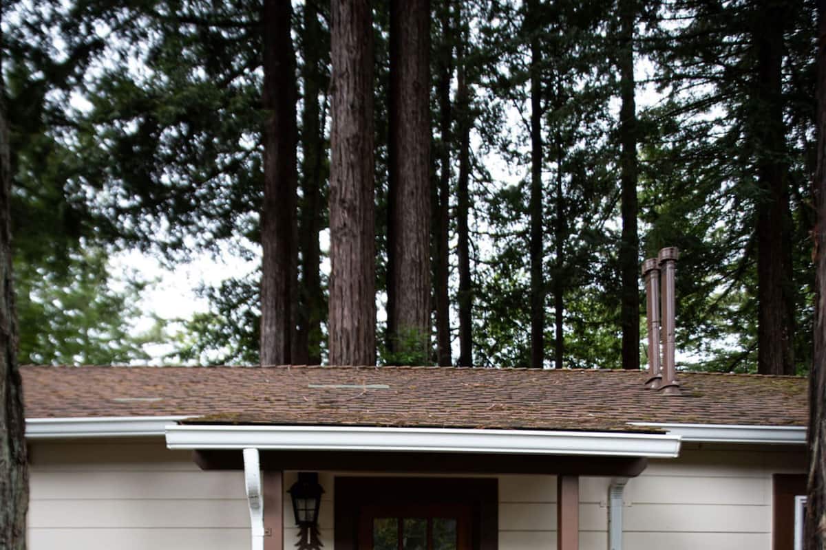 A small building with a wooden door and a small porch.