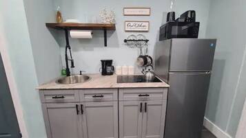 Fridge, microwave, stovetop, coffee/tea maker