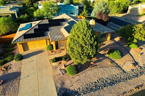 A residential property with a solar panel roof, a swimming pool, and a well-maintained garden. - Indian Cliffs Getaway ~ 3 bedroom with pool (Sedona)