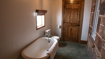 Combined shower/bathtub, towels, soap, toilet paper