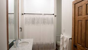 Combined shower/tub, towels, soap, toilet paper