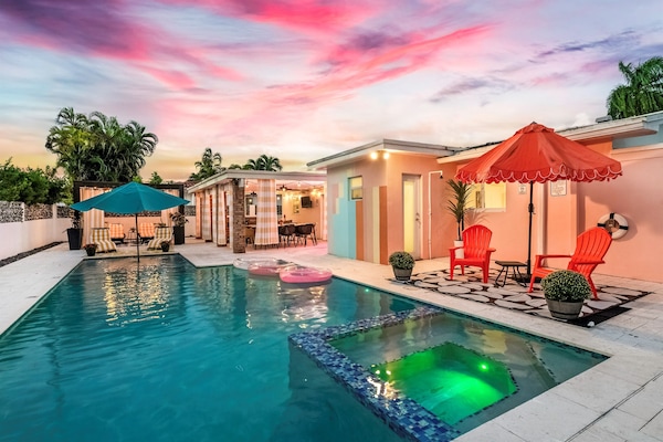Outdoor Paradise: Enjoy vibrant sunsets by the pool with colorful seating and refreshing vibes!