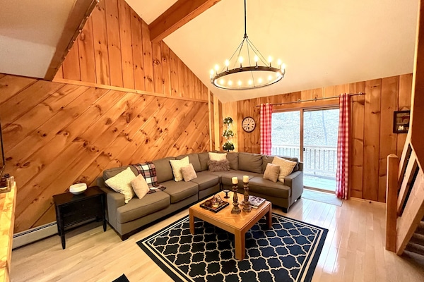 Moose House Great Room with soaring ceilings and beautiful view of the mountain.