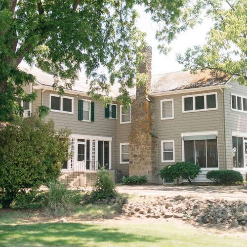 Main Residence: 5 beds, 5 baths, sleeping porches, & full kitchen.