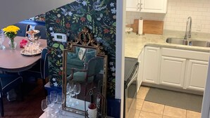 A kitchen with white cabinets, a sink, and a countertop. - Near Nashville Medical District (NASHVILLE)